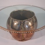Carved and painted glass top and welded copper base.