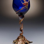 Custom copper and bronze goblet with blue glass.