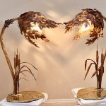 Custom copper wall sculpture installed above a dining table by Rhonda Kap