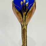Handcrafted blue flower metal sculpture with copper stem by Rhonda Kap